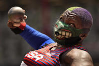 Raven Saunders, of the United States, competes in the final of the women's shot put at the 2020 Summer Olympics, Sunday, Aug. 1, 2021, in Tokyo. (AP Photo/David J. Phillip)