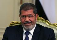 FILE PHOTO: Egypt's President Mursi participates in a meeting with U.S. Defense Secretary Panetta at the presidential palace in Cairo