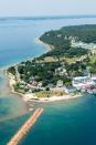 <p><strong>Where: </strong>Mackinac Island, Michigan</p><p><strong>Why We Love It: </strong>No cars are allowed on <a href="https://www.countryliving.com/life/travel/g4135/american-islands/" rel="nofollow noopener" target="_blank" data-ylk="slk:this small island;elm:context_link;itc:0;sec:content-canvas" class="link ">this small island</a> on the strait between Michigan's upper and lower peninsulas, making it an idyllic summer getaway.</p>