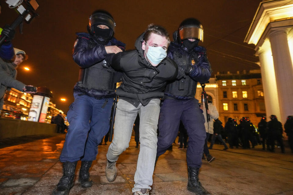 Police detain a demonstrator during an action against Russia's attack on Ukraine in St. Petersburg, Russia, Wednesday. Protests against the Russian invasion of Ukraine resumed on Wednesday, with people taking to the streets of Moscow and St. Petersburg and other Russian towns despite mass arrests. (AP Photo/Dmitri Lovetsky)