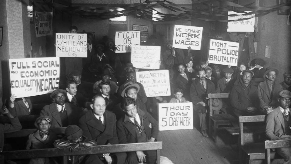 PHOTO: Labor protesters with signs: 'Full Social and Economic Equality for Negros,' 'Unity of White-and-Negro Workers,' etc. circa 1930. (HUM Images/Universal Images Group via Getty Images)