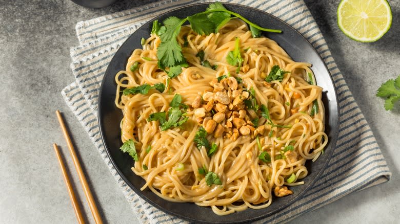 Lo mein with peanut sauce, cilantro, and lime