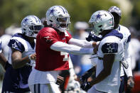 Dallas Cowboys quarterback Dak Prescott (4) and wide receiver Dennis Houston (3) participate in drills during a combined NFL practice at the Los Angeles Rams' practice facility in Costa Mesa, Calif. Thursday, Aug. 18, 2022. (AP Photo/Ashley Landis)