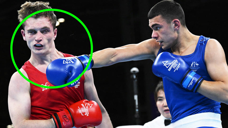 Callum Peters lands a heavy blow against Sam Hickey at the Commonwealth Games.