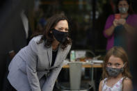 Democratic vice presidential candidate Sen. Kamala Harris, D-Calif., greets Dylan Eitto at Trophy Brewing and Pizza during a campaign visit in Raleigh, N.C., Monday, Sept. 28, 2020. (AP Photo/Gerry Broome)