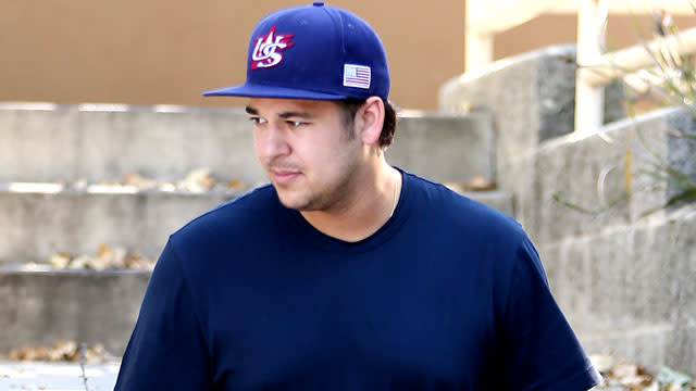 One of the more reclusive members of the Kardashian clan may finally be warming up to social media. Rob Kardashian made a return to his neglected Instagram account on Thursday to post a #TBT photo to time spent in Malibu. Although he doesn't say when exactly the photo was originally snapped, we can see Rob shirtless as he chows down on a pulled pork sandwich. <strong>WATCH: Kris Jenner Worries Rob Kardashian Is 'Going to Die,' Says He's Gained 100 Pounds In the Last Year</strong> The photo comes as somewhat of a surprise, as Rob has not only removed himself from the spotlight, but he's also been criticized as of late for his noticeable weight gain. Last April, Rob's mom, Kris Jenner, was on the verge of tears over his weight gain, but recently, his siblings have spoken lovingly about him. Just last week, his step-sister Kendall Jenner posted a throwback of her own that showed Rob laughing during an episode of <em>Keeping Up With the Kardashians</em> that aired in 2012, and his older sister Khloe Kardashian revealed that she has taken Rob into her home. <strong>PHOTOS: Wilmer Valderama Shares Hilarious #TBT in Support of Demi Lovato</strong> "Rob lives with me now and I wouldn't have it any other way. I love having him with me," Khloe told <em>Complex</em> magazine. "He's going through a hard time now and it's behind gates. With this crazy lifestyle you have to think of places where you can still have your freedom." Hopefully, this is a sign that Kardashian fans will see more of Rob in the upcoming season of <em>KUWTK</em> or in Caitlyn Jenner's new show, <em>I Am Cait</em>, where he briefly appeared in the premiere. See more from the premiere of <em>I Am Cait</em> in the video below.