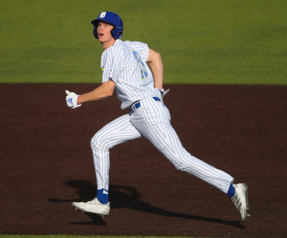 Delaware baserunner Brett Lesher watches a hit as he leaves first base in the Blue Hens' 14-12 win Tuesday, March 21, 2023 at Bob Hannah Stadium.
