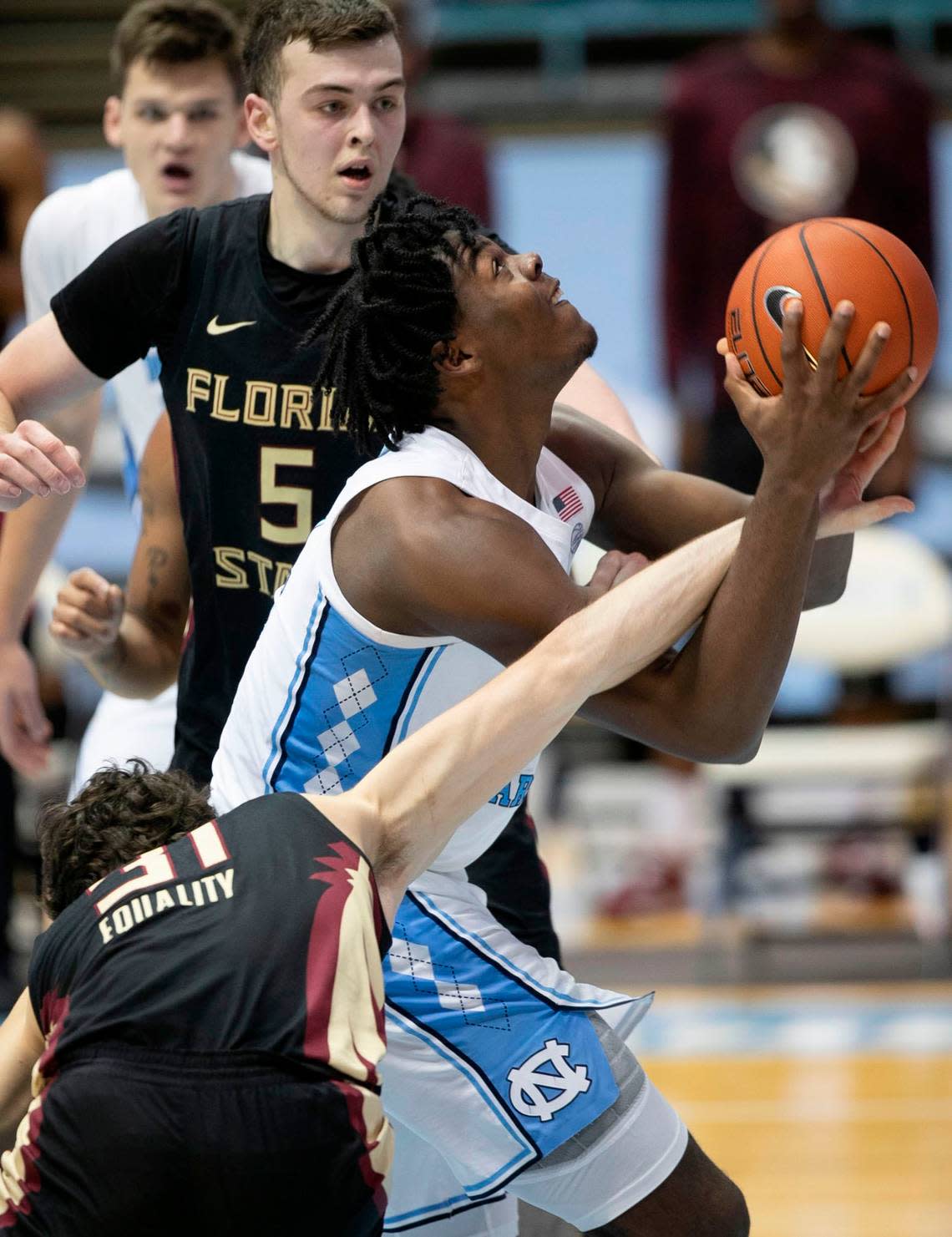 Florida State’s Wyatt Wilkes (31) fouls North Carolina’s Day’Ron Sharpe (11) during the first half on Saturday, February 27, 2021 in Chapel Hill, N.C.