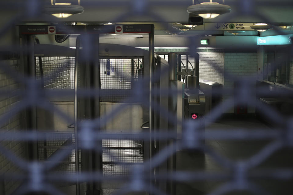 A subway station remains closed Friday, Dec. 6, 2019 in Paris. Frustrated travelers are meeting transportation chaos around France for a second day, as unions dig in for what they hope is a protracted strike against government plans to redesign the national retirement system. (AP Photo/Rafael Yaghobzadeh)