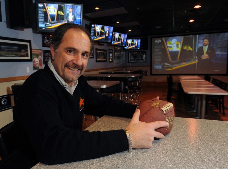 Dino Mitrokostas at Dino's Sports Bar in Mashpee in 2016 prepares for the Super Bowl LVII with all TVs turned to the game.