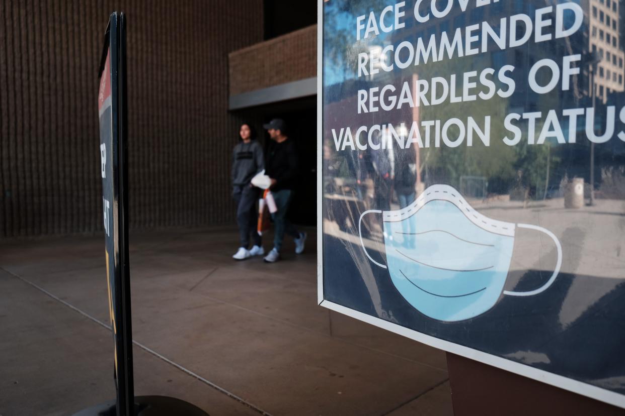 A sign asks visitors to wear a mask in downtown Phoenix.