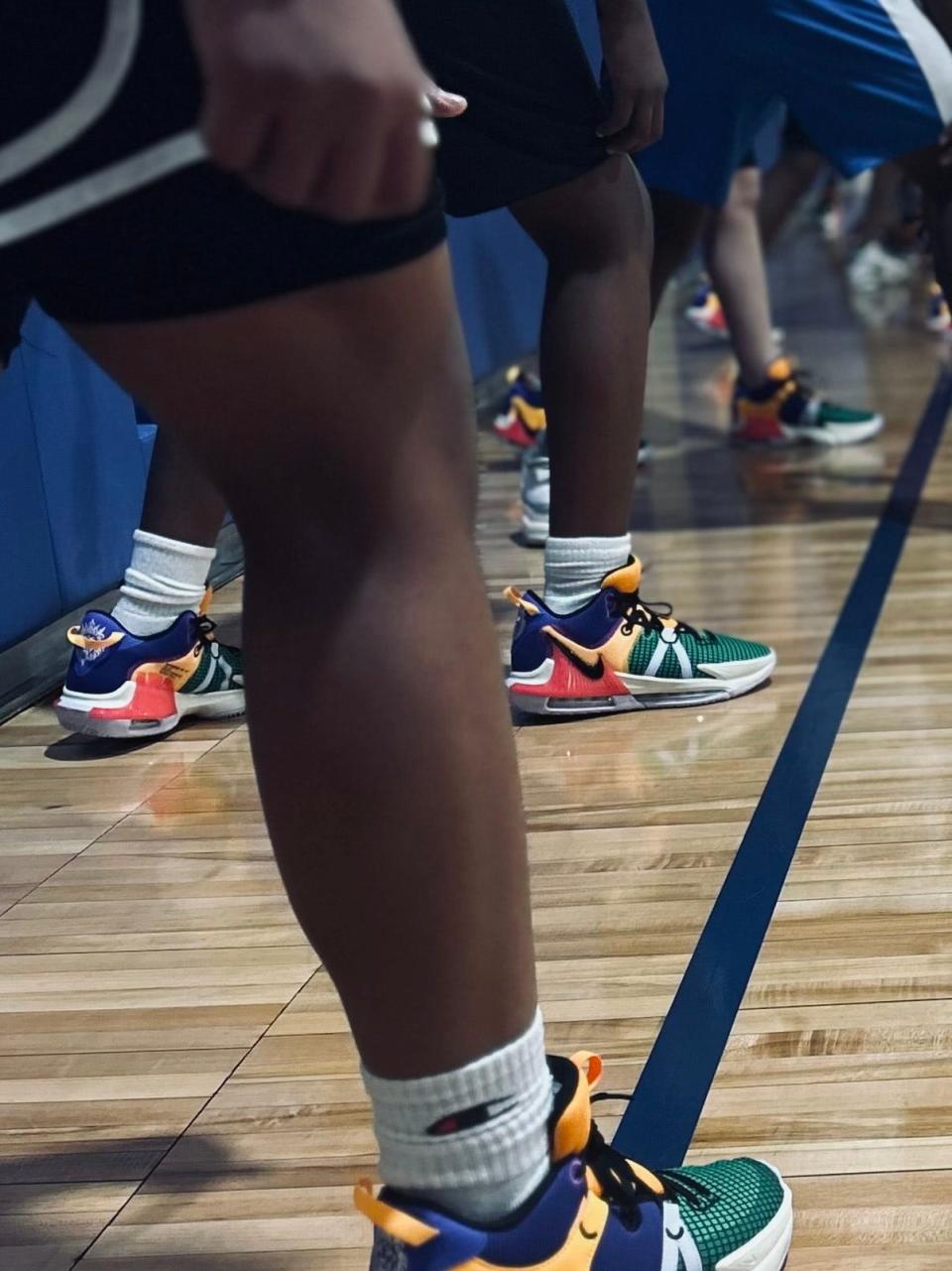A few of the Paramount School basketball players have their game shoes on before practice. Coach Michael Hunt purchased the LeBron James shoes for the players.