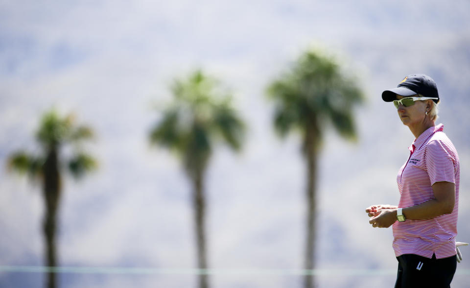 Karrie Webb, of Australia, waits to putt on the 11th green during the pro-am at the LPGA Kraft Nabisco Championship golf tournament Wednesday, April 2, 2014 in Rancho Mirage, Calif. (AP Photo/Chris Carlson)