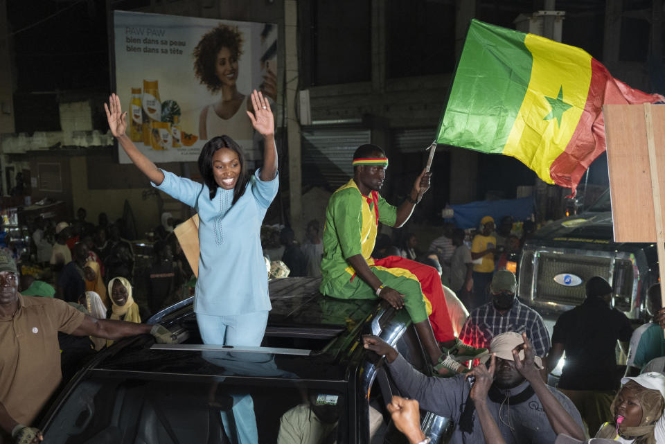 Presidential candidate Anta Babacar Ngom greets supporters during her electoral campaign caravan in Dakar, Senegal, Monday, March 11, 2024. Senegal’s only female presidential candidate may stand no chance of winning but activists say her presence alone is helping to advance a decades long campaign to achieve equality in the West African nation. (AP Photo/Sylvain Cherkaoui)