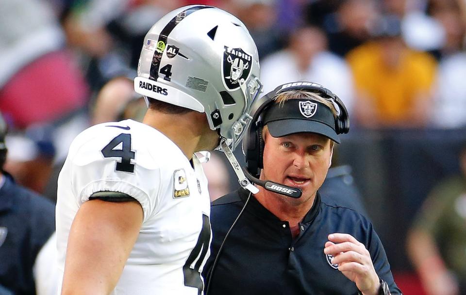 Things got tense on the sideline between head coach Jon Gruden and quarterback Derek Carr. The Raiders eventually prevailed Sunday for their second win of the season. (AP)