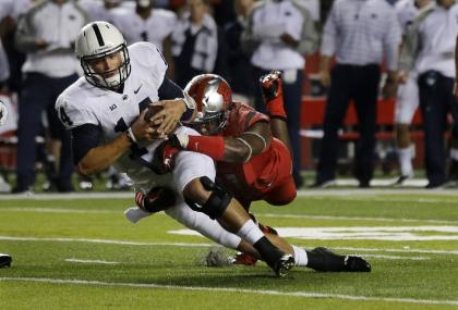 Penn State quarterback Christian Hackenberg (14) is sacked by Rutgers defensive lineman Darius Hamilton (91)during the third quarter of an NCAA college football game Saturday, Sept. 13, 2014, in Piscataway, N.J. (AP Photo/Mel Evans)