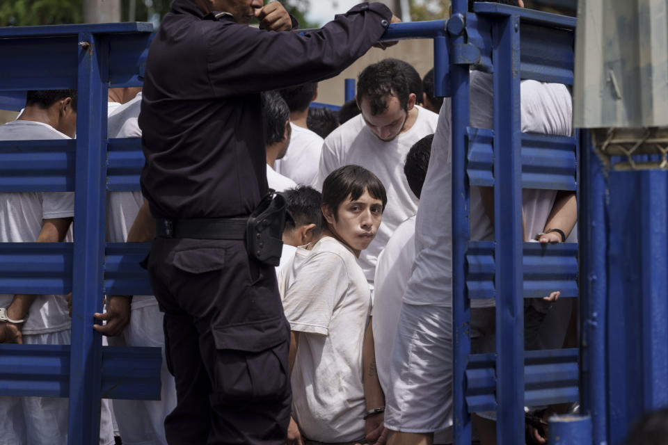 FILE - Men who are detained under a state of emergency arrive at a detention center, transported there by National Police in a cargo truck, in Soyapango, El Salvador, Oct. 7, 2022. President Nayib Bukele's government declared a state of emergency on March 27, 2022, a measure suspending constitutional rights in an effort to confront surging gang violence. (AP Photo/Moises Castillo, File)