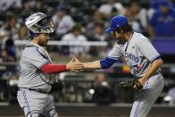 Toronto Blue Jays relief pitcher Jordan Romano, right, celebrates with catcher Alejandro Kirk after the team's 3-0 win in a baseball game against the New York Mets on Friday, June 2, 2023, in New York. (AP Photo/Frank Franklin II)