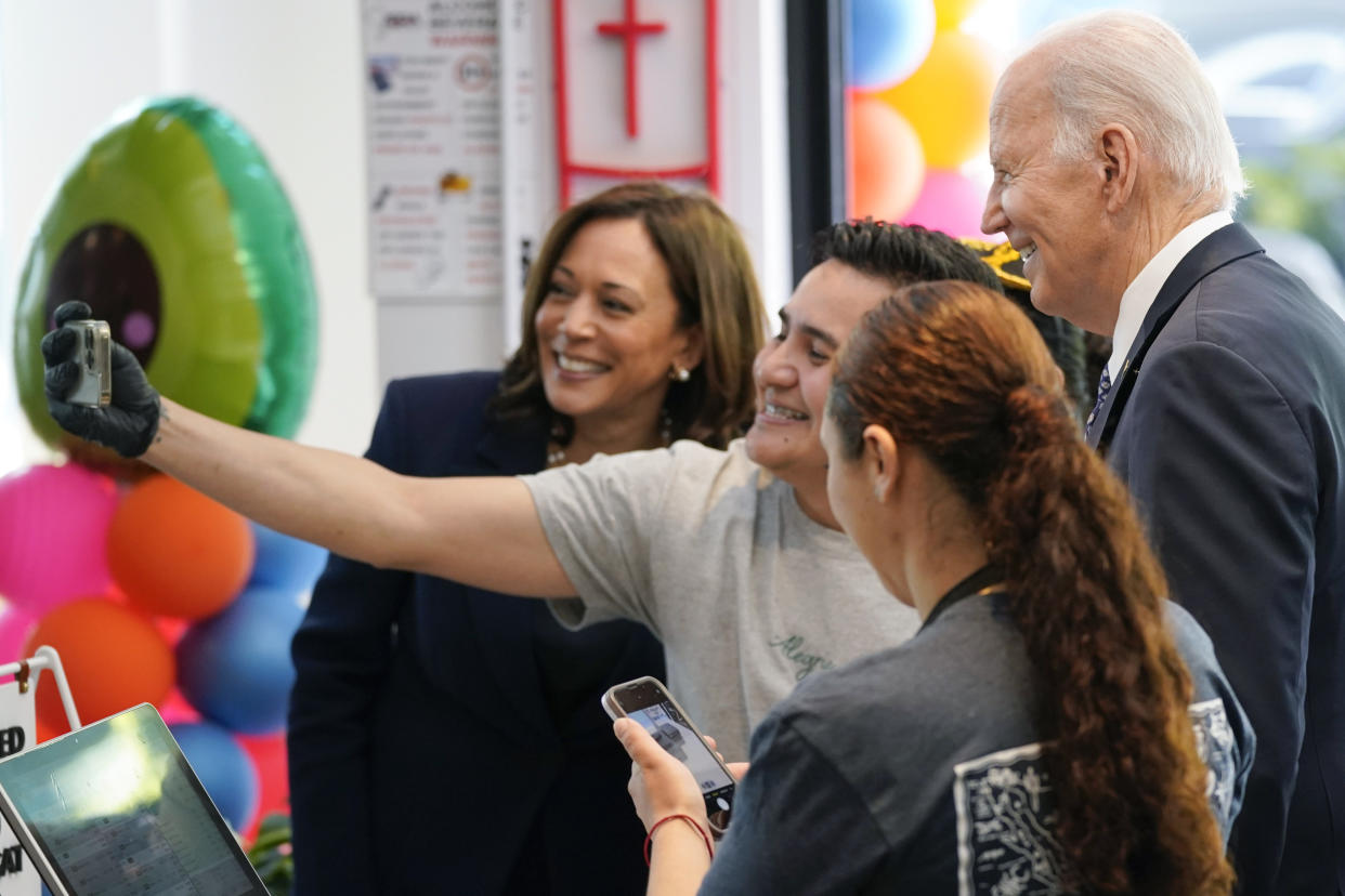 President Joe Biden and Vice President Kamala Harris pose for photo with a worker at Taqueria Habanero restaurant on Friday, May 5, 2023, in Washington. (AP Photo/Evan Vucci)