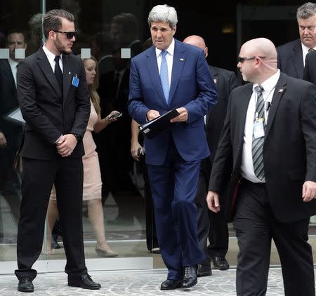 U.S. Secretary of State John Kerry leaves a meeting at a hotel in Vienna July 14, 2014. REUTERS/Heinz-Peter Bader