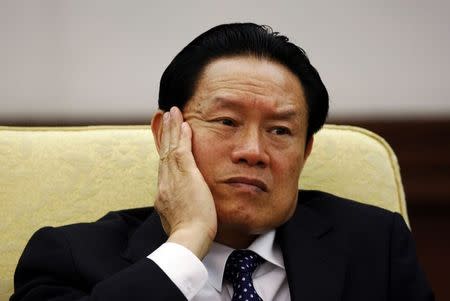 Then China's Public Security Minister Zhou Yongkang reacts as he attends the Hebei delegation discussion sessions at the 17th National Congress of the Communist Party of China at the Great Hall of the People in Beijing in this October 16, 2007 file photo. REUTERS/Jason Lee/Files