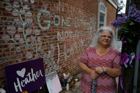 Susan Bro, mother of Heather Heyer, who was killed during the August 2018 white nationalist rally in Charlottesville, stands at the memorial at the site where her daughter was killed in Charlottesville, Virginia, U.S., July 31, 2018. REUTERS/Brian Snyder