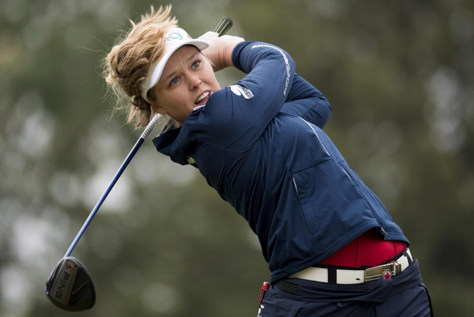 Brooke Henderson of Smiths Falls, Ontario tees off on the fourth hole during the Women's Canadian Open golf tournament in Regina, Saskatchewan, Sunday Aug. 26, 2018. (Jonathan Hayward/The Canadian Press via AP)