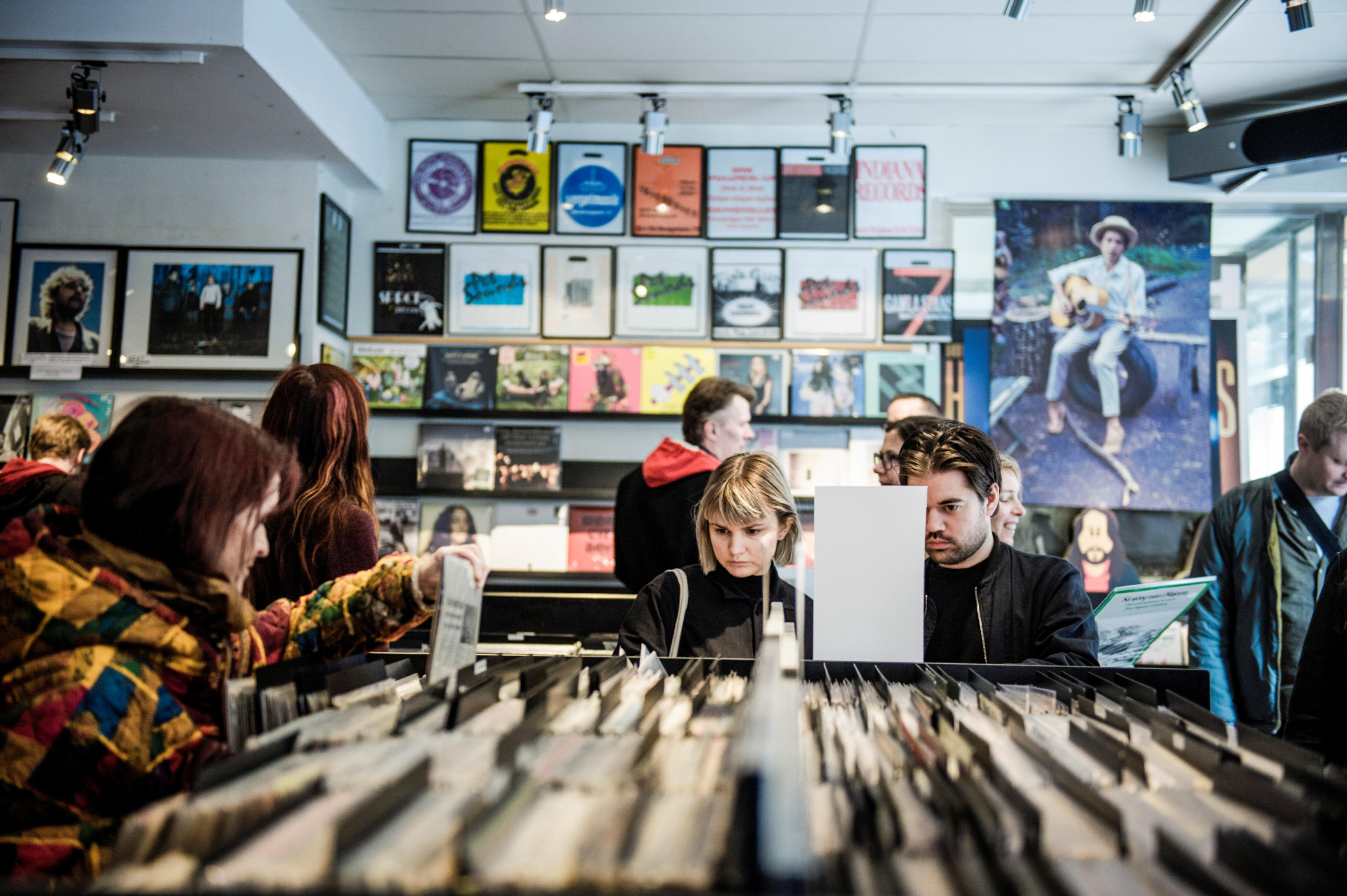 Customers browse albums in a record store during Record Store Day in Stockholm.