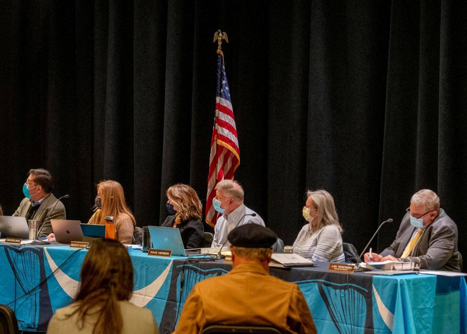 The York School Committee listens to public comment during a meeting Wednesday, Dec. 2, 2021, in York, Maine, as librarians and other community members spoke in opposition to a request that sought to have a book removed from the YMS library.