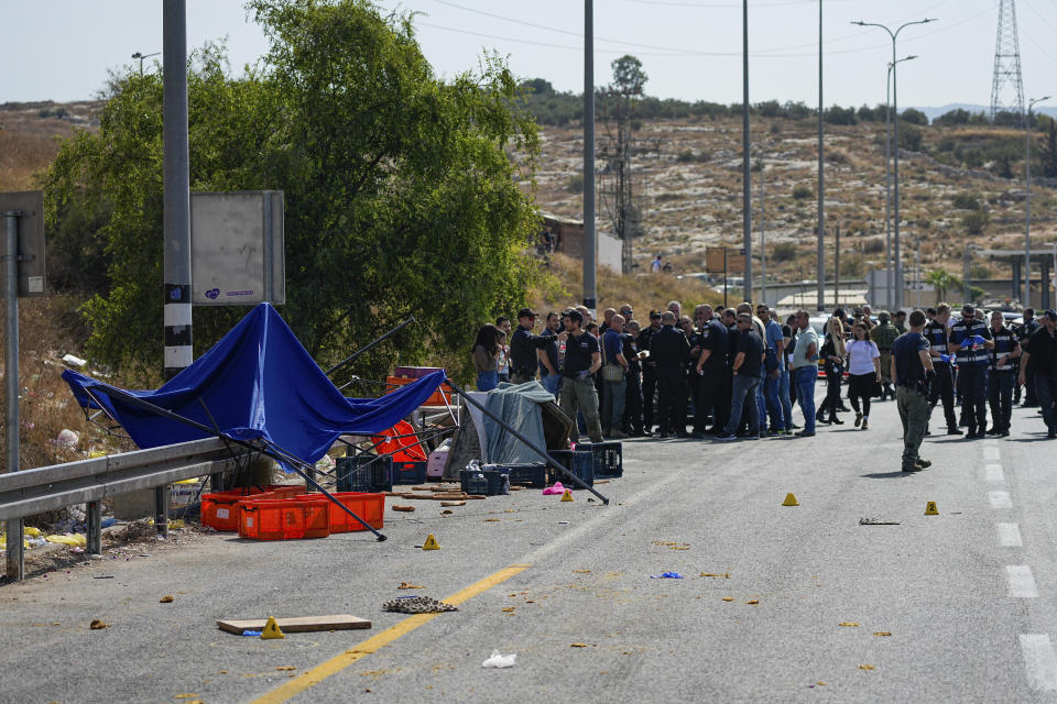 Israeli security forces inspect the scene of a Palestinian ramming attack near West Bank Maccabim checkpoint, Thursday, Aug. 31, 2023. A Palestinian driver slammed his truck into pedestrians at a busy checkpoint in the occupied West Bank on Thursday, killing one Israeli before being shot, Israeli authorities said. (AP Photo/Ohad Zwigenberg)