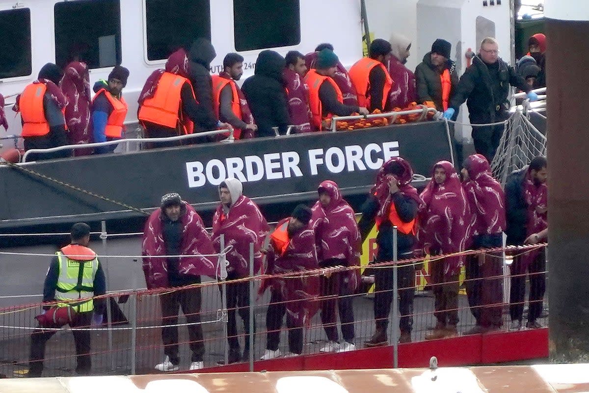 A group of people thought to be migrants are brought into Dover, Kent, following a small boat incident in the Channel (Gareth Fuller/PA) (PA Wire)