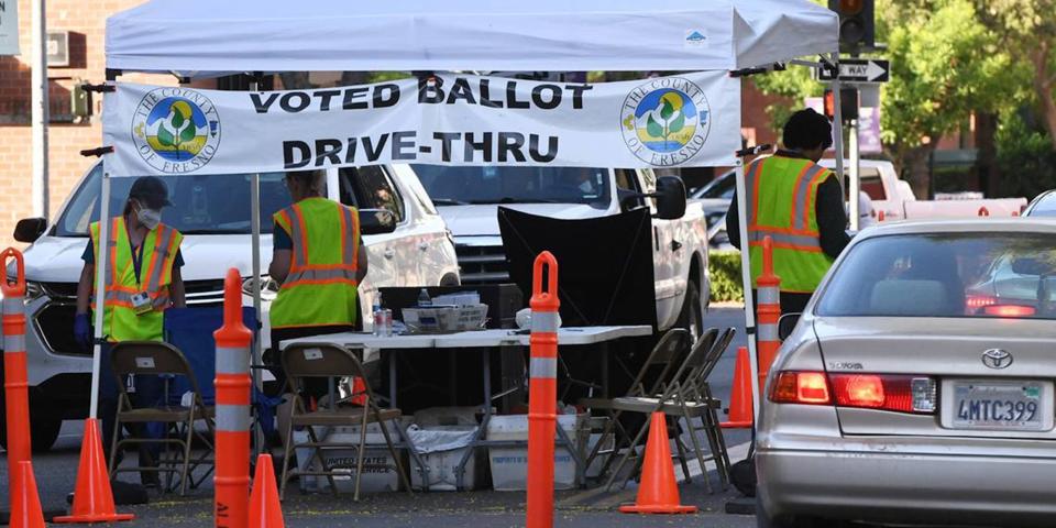 The County Clerk's drive-thru ballot drop-off station on Kern Street is busy late Tuesday afternoon, June 7, 2022, in Fresno.