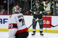 Minnesota Wild center Vinni Lettieri, right, celebrates his goal against the Ottawa Senators during the third period of an NHL hockey game Tuesday, April 2, 2024, in St. Paul, Minn. (AP Photo/Matt Krohn)