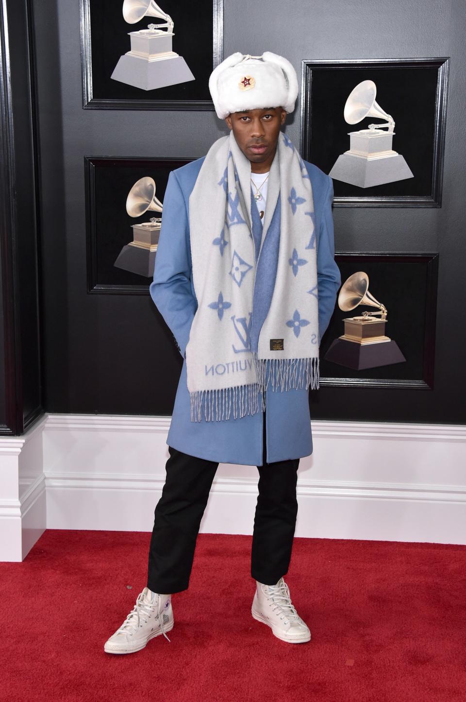 Tyler, the Creator in a Louis Vuitton scarf and Converse sneakers