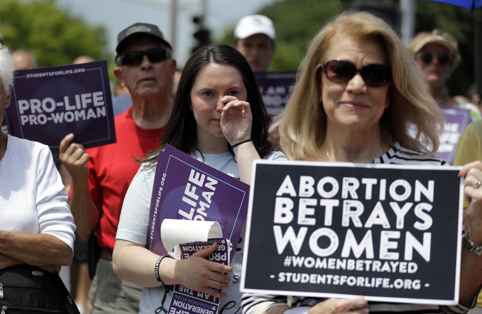 Anti-abortion supporters gather outside the Planned Parenthood clinic Tuesday, June 4, 2019, in St. Louis. A judge is considering whether the clinic, Missouri's only abortion provider, can remain open. (AP Photo/Jeff Roberson)