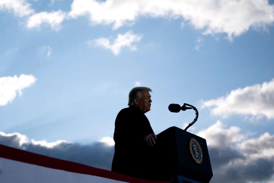 Donald Trump speaks during a farewell ceremony as he departed Washington on 20 January.