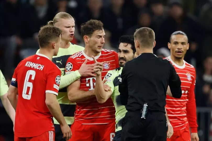 MUNICH, GERMANY - APRIL 19: Ilkay Gundogan of Manchester City reacts at Joshua Kimmich of Bayern Munich while Leon Goretzka of Bayern Munich and Clement Turpin, Referee steps in during the UEFA Champions League Quarterfinal Second Leg match between FC Bayern Munich and Manchester City at Allianz Arena on April 19, 2023 in Munich, Germany.