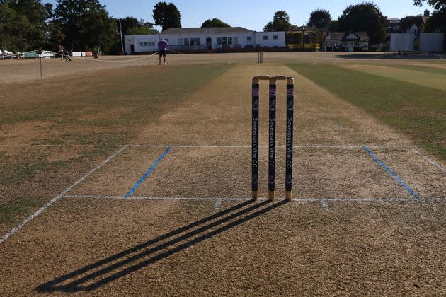 The long shadow of the stumps is seen on the dry ground at Sevenoaks Vine Cricket Club in Kent. (Photo: HOLLIE ADAMS via Getty Images)