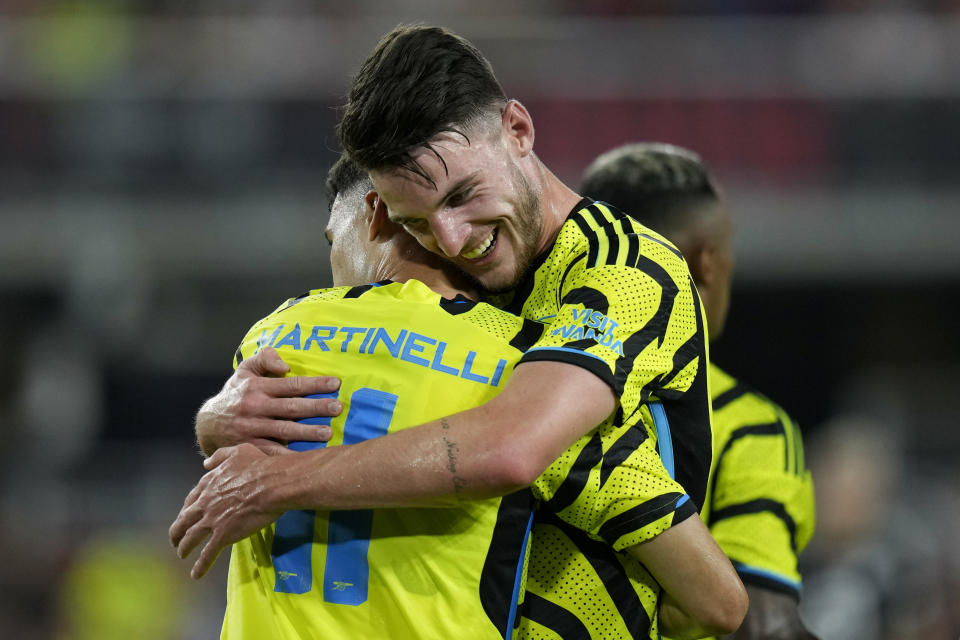 Arsenal midfielder Declan Rice, right, hugs teammate Gabriel Martinelli after Martinelli scored a goal in the second half of the MLS All-Star soccer match against the MLS All-Stars, Wednesday, July 19, 2023, in Washington. (AP Photo/Alex Brandon)