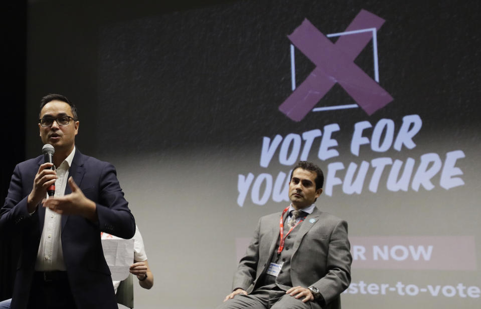 Labour councillor Abdul Hal, left, speaks alongside Hector Birchwood, Brexit Party candidate for Holborn and St Pancras during a Vote For Your Future Hustings at Westminster Kingsway College in London, Tuesday, Nov. 19, 2019. There is a generation of young people who weren't old enough to vote in the Brexit referendum, but those young voters could hold the key to victory in the upcoming Dec. 12 General Election for which-ever party can garner their vote. (AP Photo/Kirsty Wigglesworth)