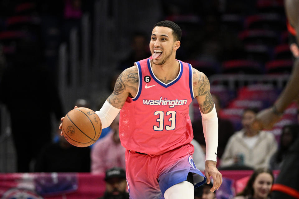 Washington Wizards forward Kyle Kuzma (33) dribbles during the first half of an NBA basketball game against the Toronto Raptors, Thursday, March 2, 2023, in Washington. (AP Photo/Nick Wass)