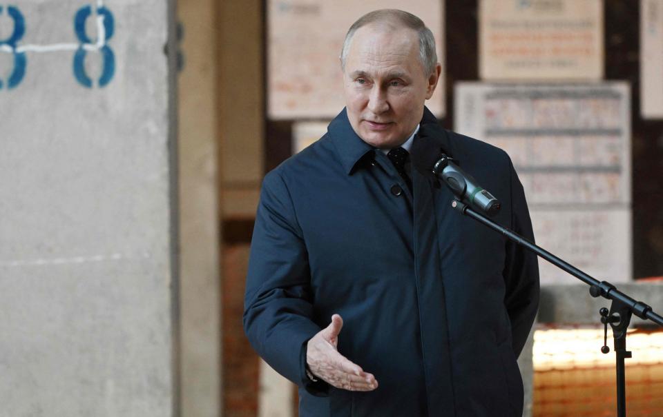 Russian President Vladimir Putin visits the National Space Centre construction site in Moscow on February 27, 2022.