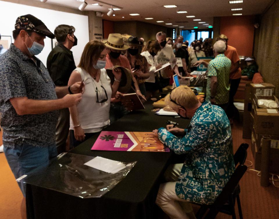 Fans wait in line for the artist known as Shag to sign his work Feb. 20, 2022, outside the Annenberg Theater during his Modernism Week event.