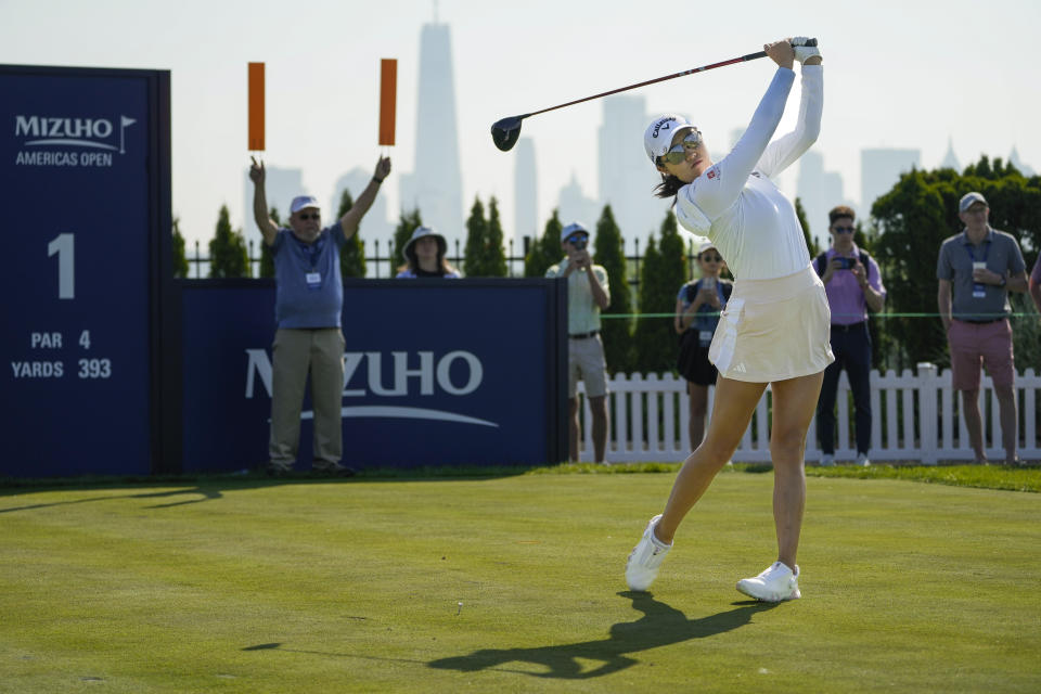 Rose Zhang hits off the first tee during the first round of the Mizuho Americas Open golf tournament, Thursday, June 1, 2023, at Liberty National Golf Course in Jersey City, N.J. (AP Photo/John Minchillo)