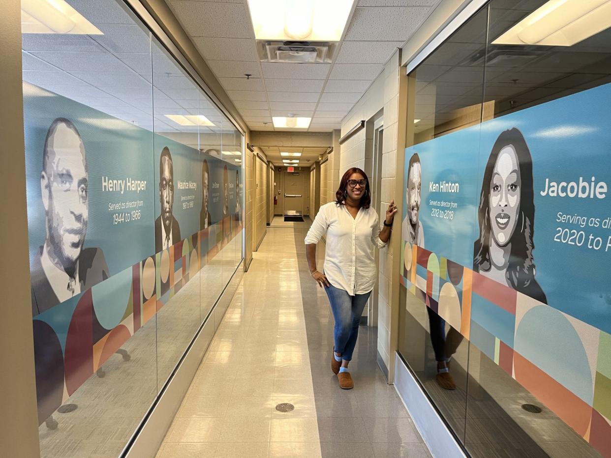 Jacobie Proctor was hired as the CEO of George Washington Carver Center in 2020. Murals at the hallway honor all of the 101-year-old center's leaders.
