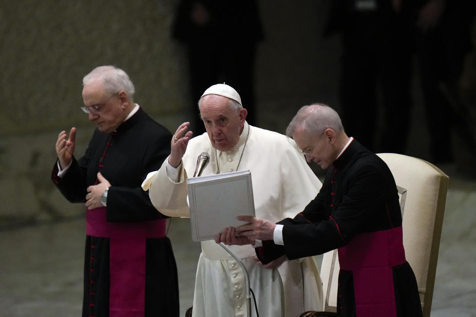 Pope Francis delivers his blessing at the end of his weekly general audience in the Paul VI Hall, at the Vatican, Wednesday, Dec. 22, 2021. (AP Photo/Alessandra Tarantino)