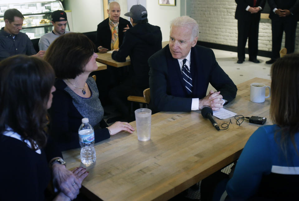 Vice President Joe Biden meets with women who have either signed up for coverage or have helped others sign up for insurance under the federal health care law during a stop at Moose and Sadie's coffee shop Wednesday, Feb. 19, 2014 in Minneapolis. Biden was in town for a fundraiser. (AP Photo/Jim Mone, Pool)