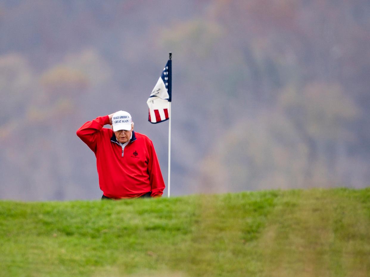 President Donald Trump plays golf for the 143rd time since becoming president at the Trump National Golf Club in Sterling, Virginia, USA, 21 November 2020 (EPA)