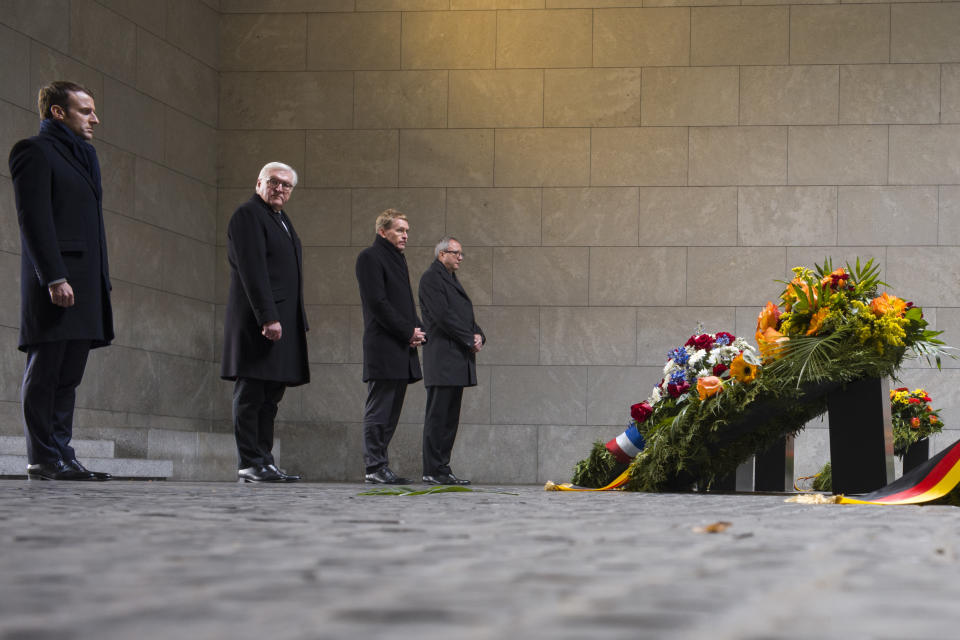 From right: France's President Emmanuel Macron, German President Frank-Walter Steinmeier, the President of Germany's upper house Bundesrat Daniel Guenther and the President of Germany's Federal Constitutional Court Andreas Vosskuhle attend a wreath laying ceremony at the Central Memorial for the Victims of War and Dictatorship in Berlin, Sunday, Nov. 18, 2018. (AP Photo/Markus Schreiber)