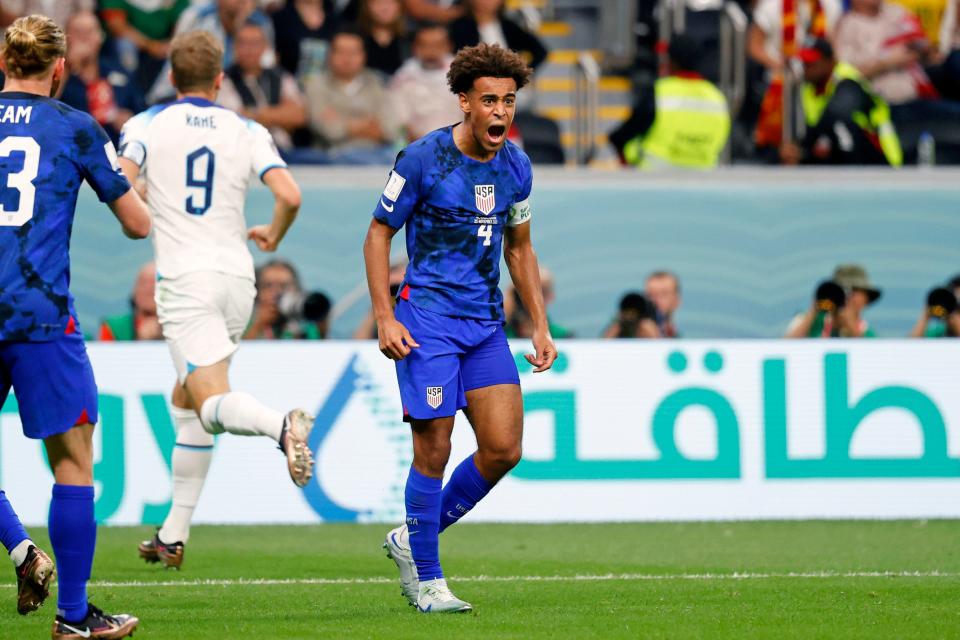 Nov 25, 2022; Al Khor, Qatar; United States of America midfielder Tyler Adams (4) reacts after making a defensive stop against England during the second half of a group stage match during the 2022 World Cup at Al Bayt Stadium.